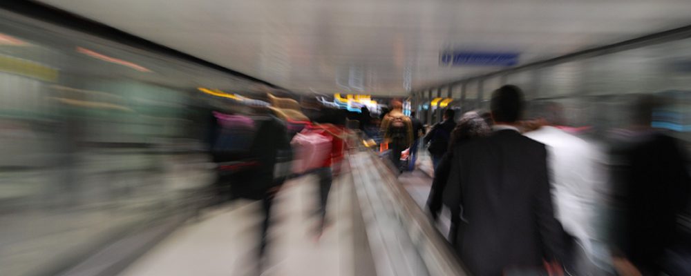 Passengers motion passengers in a rush at a international airport (intentional blur motion)