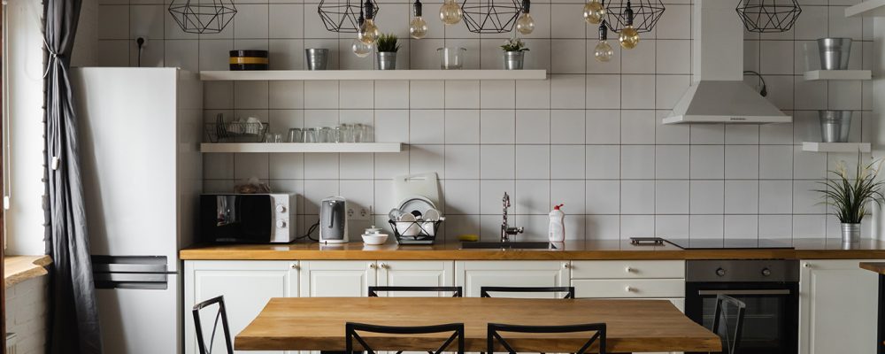 Modern, Bright, Clean, Kitchen Interior With Stainless Steel App Modern, bright, clean, kitchen interior with stainless steel appliances in a luxury house. Kitchen in luxury mansion. Modern architecture contemporary, interior. Stylish kitchens interior with table.